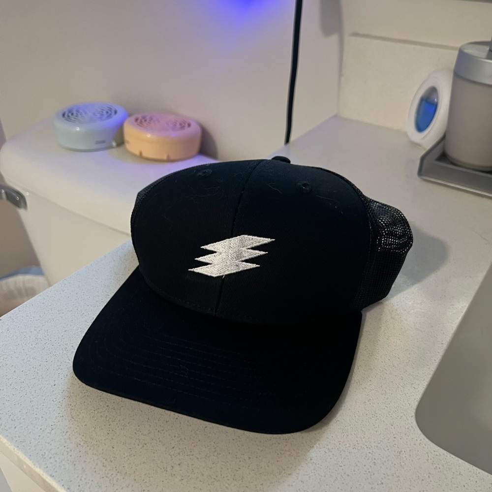 Black Trucker Hat with White Logo